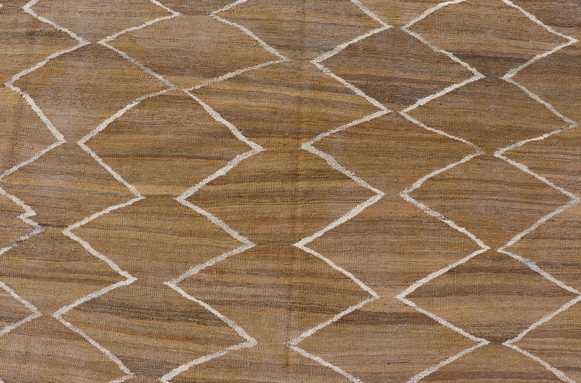 Hand - Woven Flatweave Kilim in Wool with Sub - Geometric Design in Marigold & Ivory This flat - weave kilim has been hand - woven. The rug features a modern diamond design, rendered in marigold, ivory and brown tones; making this rug a superb fit for a... - Keivan Woven ArtsAFG - 27588 - 19700Rug