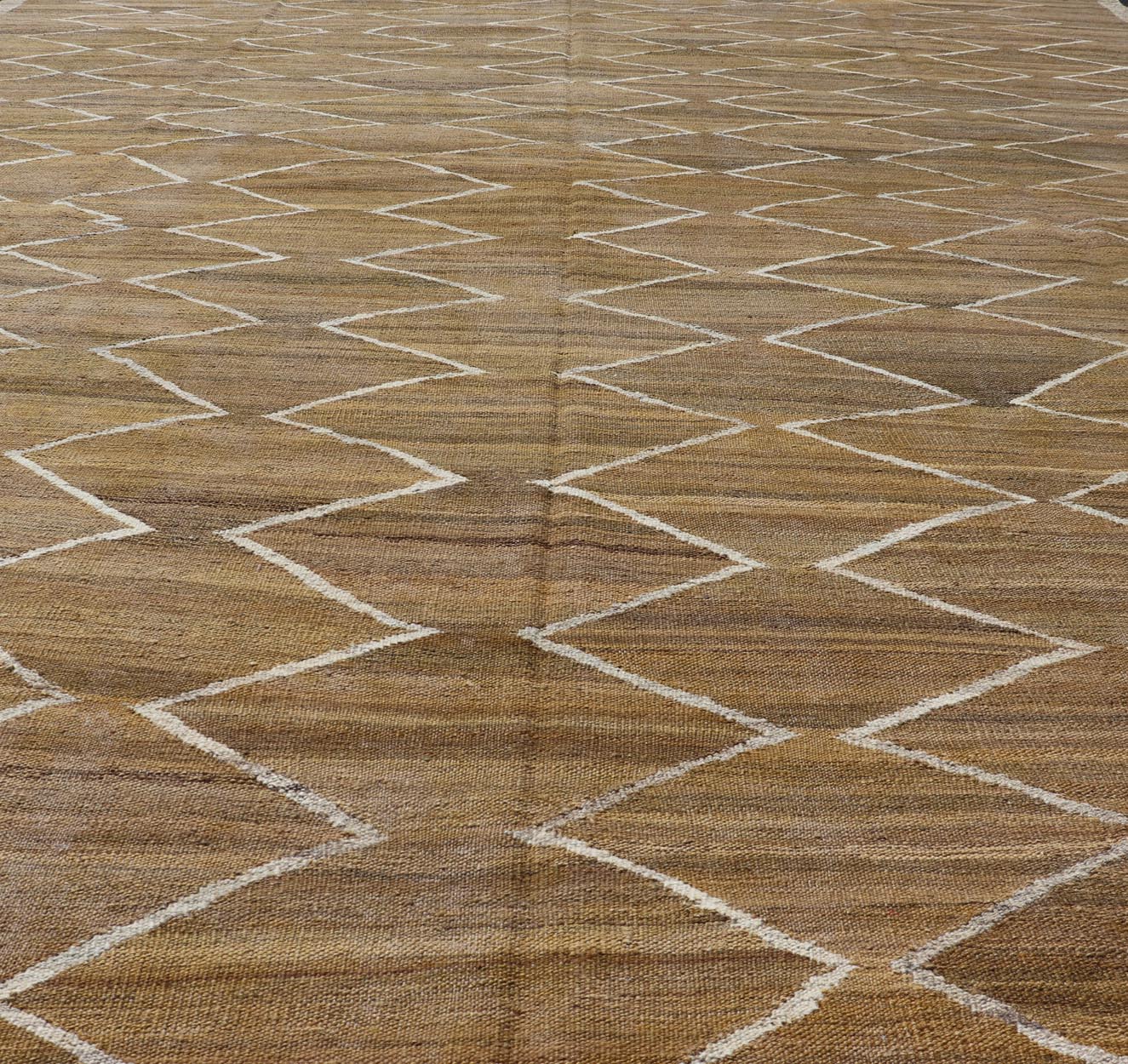 Hand - Woven Flatweave Kilim in Wool with Sub - Geometric Design in Marigold & Ivory This flat - weave kilim has been hand - woven. The rug features a modern diamond design, rendered in marigold, ivory and brown tones; making this rug a superb fit for a... - Keivan Woven ArtsAFG - 27588 - 19700Rug