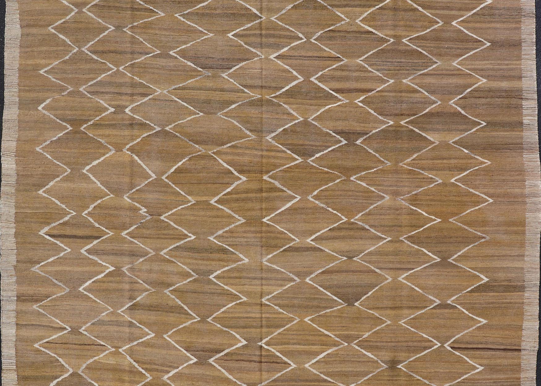 Hand - Woven Flatweave Kilim in Wool with Sub - Geometric Design in Marigold & Ivory This flat - weave kilim has been hand - woven. The rug features a modern diamond design, rendered in marigold, ivory and brown tones; making this rug a superb fit for a... - Keivan Woven ArtsAFG - 27588 - 19700Rug