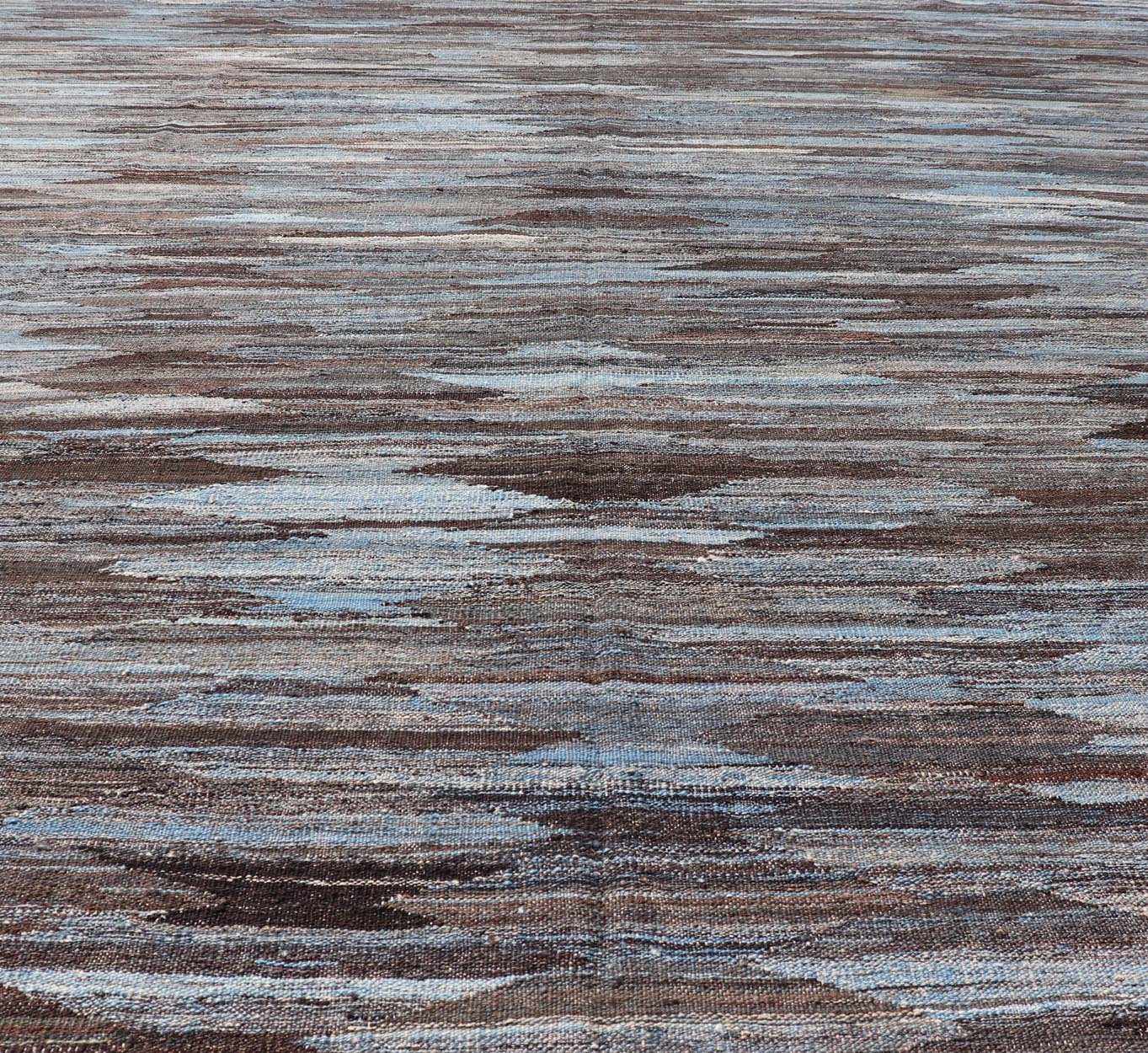 Modern Flatweave Kilim in Wool With Sub - Geometric Diamond Design in Blue and Charcoal. This flat - weave kilim has been hand - woven. The rug features a modern all - over diamond design, rendered in blue and brown tones; making this rug a superb fit for ... - Keivan Woven ArtsAFG - 29504 - 19736Rug