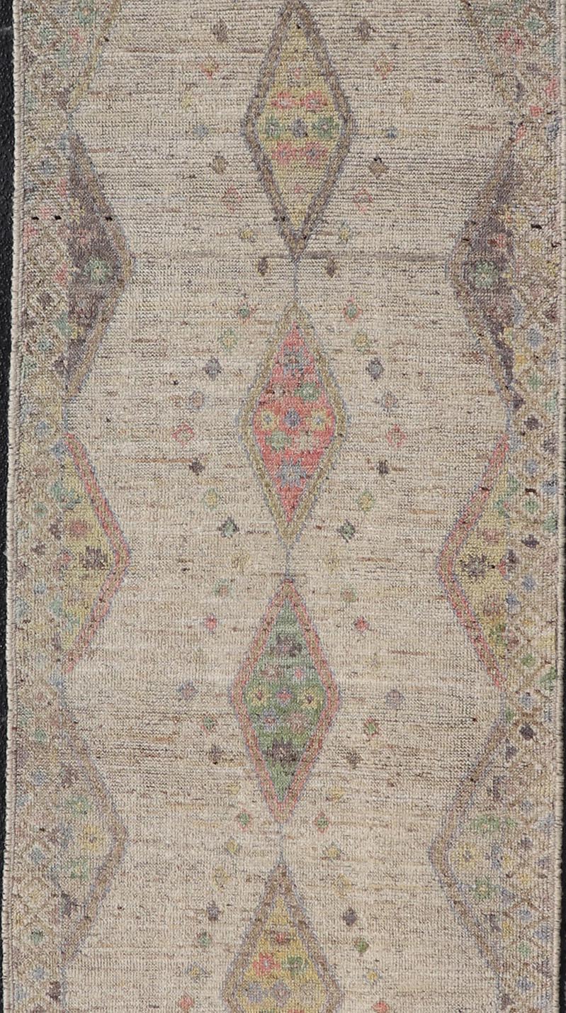 Modern Hand - Knotted Runner with Sub - Geometric Diamond Design in Wool This modern casual tribal rug has been hand - knotted in wool. The rug features a modern sub - geometric diamond design, rendered in multicolor, and enclosed within a complemen... - Keivan Woven ArtsAFG - 39502 - 19754Rug