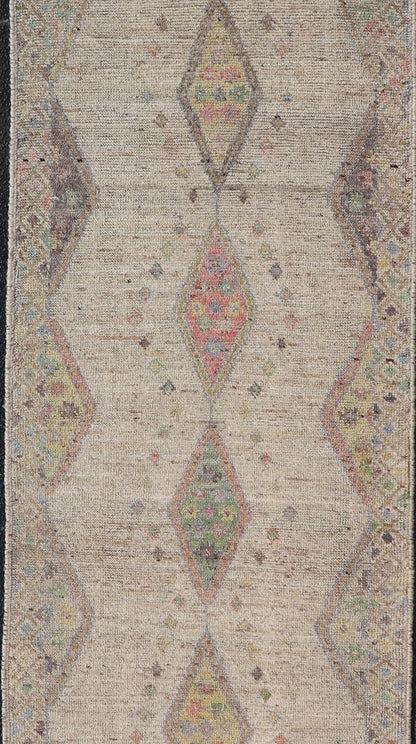 Modern Hand - Knotted Runner with Sub - Geometric Diamond Design in Wool This modern casual tribal rug has been hand - knotted in wool. The rug features a modern sub - geometric diamond design, rendered in multicolor, and enclosed within a complemen... - Keivan Woven ArtsAFG - 39502 - 19754Rug
