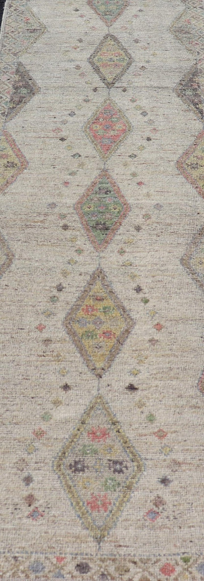 Modern Hand - Knotted Runner with Sub - Geometric Diamond Design in Wool This modern casual tribal rug has been hand - knotted in wool. The rug features a modern sub - geometric diamond design, rendered in multicolor, and enclosed within a complemen... - Keivan Woven ArtsAFG - 39502 - 19754Rug