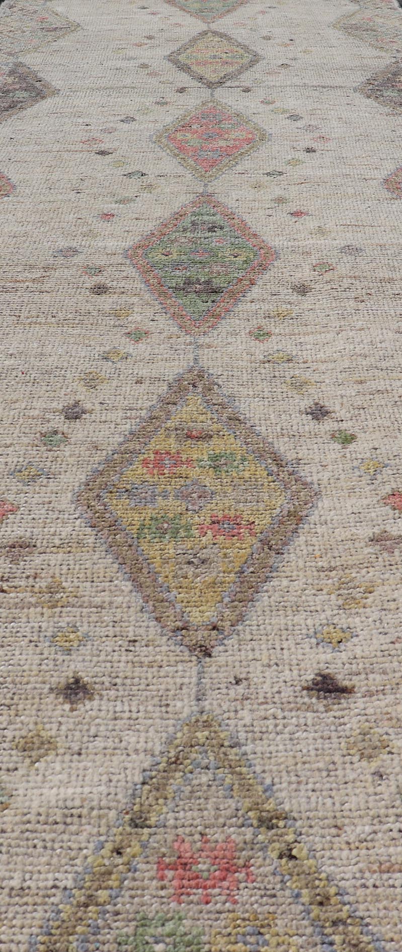 Modern Hand - Knotted Runner with Sub - Geometric Diamond Design in Wool This modern casual tribal rug has been hand - knotted in wool. The rug features a modern sub - geometric diamond design, rendered in multicolor, and enclosed within a complemen... - Keivan Woven ArtsAFG - 39502 - 19754Rug