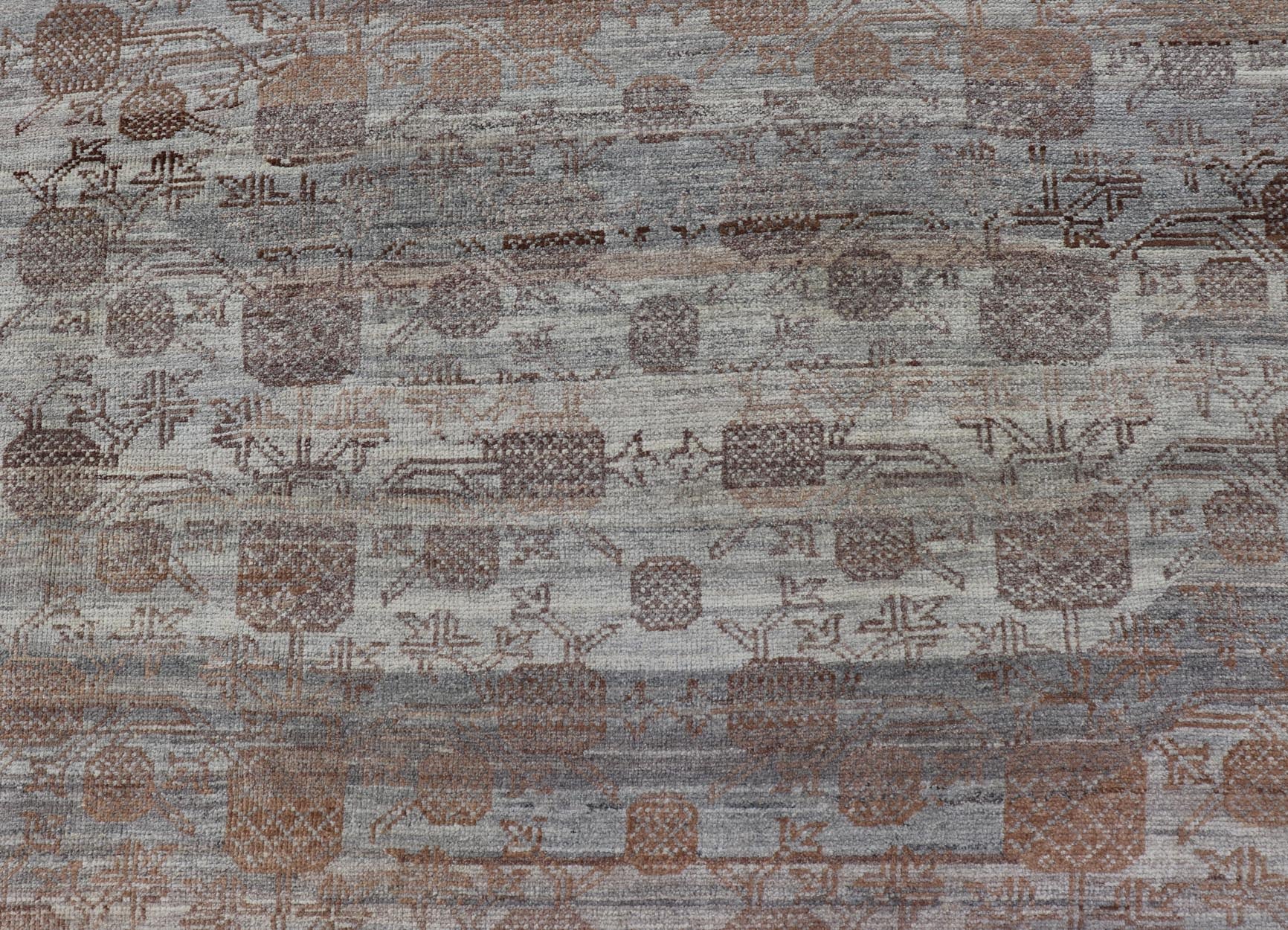 Modern Hand - Knotted Khotan Rug with Sub - Geometric Pomegranate Design This modern casual tribal rug has been hand - knotted. The rug features a modern sub - geometric pomegranate design and is enclosed within a complementary, multi - tiered border, re... - Keivan Woven ArtsAFG - 39680 - 19826Rug