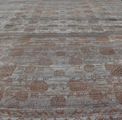Modern Hand - Knotted Khotan Rug with Sub - Geometric Pomegranate Design This modern casual tribal rug has been hand - knotted. The rug features a modern sub - geometric pomegranate design and is enclosed within a complementary, multi - tiered border, re... - Keivan Woven ArtsAFG - 39680 - 19826Rug