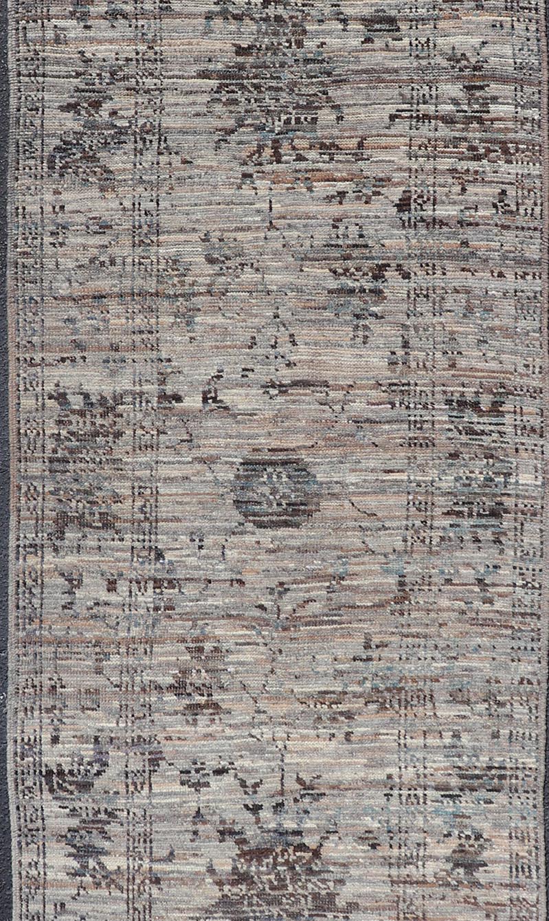 Modern Oushak Designed Runner in Wool with Floral Design in Earthy Tones This modern casual tribal runner has been hand - knotted in wool. The runner features a modern sub - geometric floral design, and is enclosed within a complementary, multi - tie... - Keivan Woven ArtsAFG - 39879 - 19568Rug