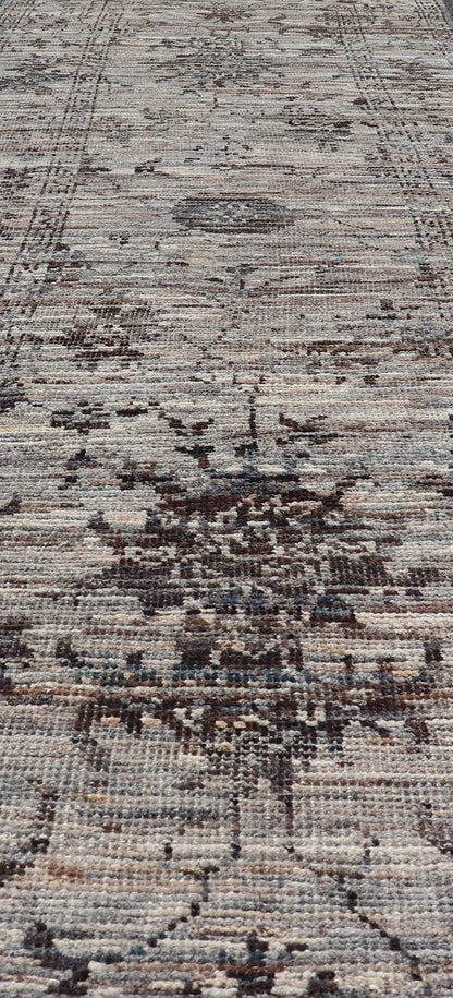 Modern Oushak Designed Runner in Wool with Floral Design in Earthy Tones This modern casual tribal runner has been hand - knotted in wool. The runner features a modern sub - geometric floral design, and is enclosed within a complementary, multi - tie... - Keivan Woven ArtsAFG - 39879 - 19568Rug