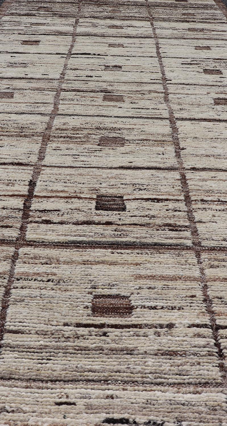 Modern Hand - Knotted Runner in Wool with Box Design in Brown and Neutral Tones This modern casual tribal rug has been hand - knotted in wool. The rug features a modern sub - geometric box design, rendered in brown and neutral tones; making this rug ... - Keivan Woven ArtsAFG - 39892 - 19580Rug