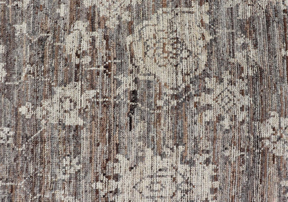 This modern tribal Oushak designed rug has been hand - knotted in wool. The rug features a modern sub - geometric floral design which is enclosed within a complementary, multi - tiered border. The rug is rendered in brown, cream and earthy tones. Measures... - Keivan Woven ArtsAFG - 39912 - 19592Rug