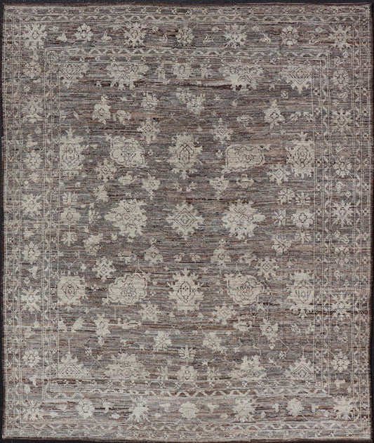 This modern tribal Oushak designed rug has been hand - knotted in wool. The rug features a modern sub - geometric floral design which is enclosed within a complementary, multi - tiered border. The rug is rendered in brown, cream and earthy tones. Measures... - Keivan Woven ArtsAFG - 39912 - 19592Rug