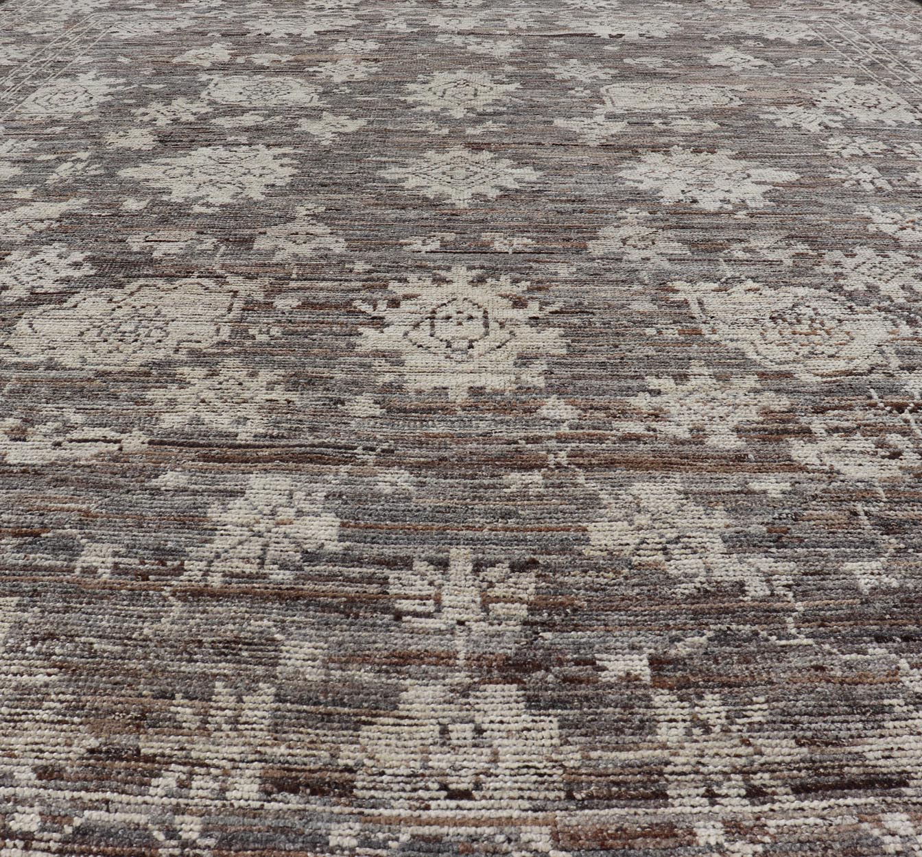 This modern tribal Oushak designed rug has been hand - knotted in wool. The rug features a modern sub - geometric floral design which is enclosed within a complementary, multi - tiered border. The rug is rendered in brown, cream and earthy tones. Measures... - Keivan Woven ArtsAFG - 39912 - 19592Rug