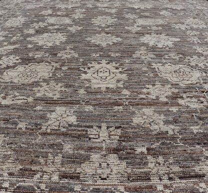 This modern tribal Oushak designed rug has been hand - knotted in wool. The rug features a modern sub - geometric floral design which is enclosed within a complementary, multi - tiered border. The rug is rendered in brown, cream and earthy tones. Measures... - Keivan Woven ArtsAFG - 39912 - 19592Rug