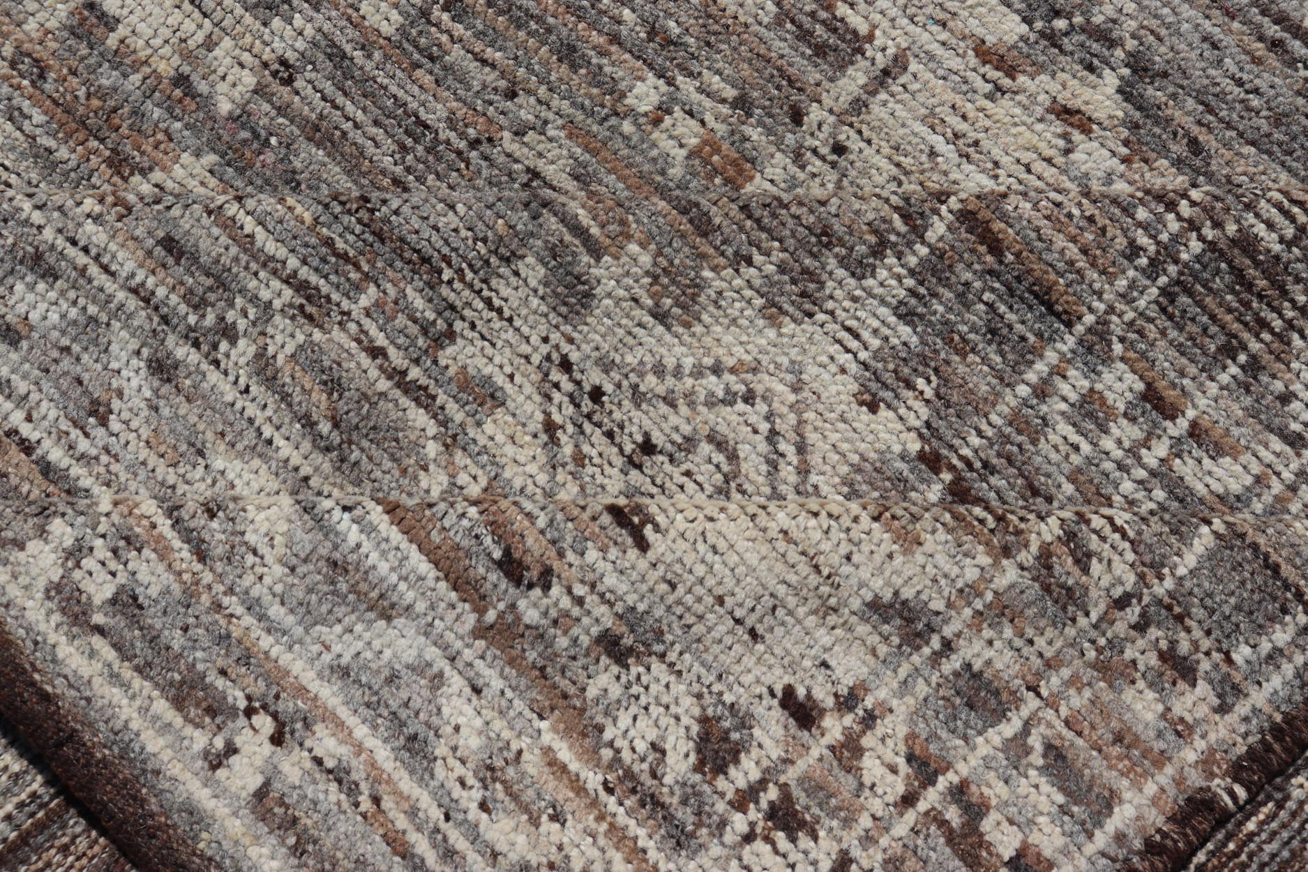 This modern tribal Oushak designed rug has been hand - knotted in wool. The rug features a modern sub - geometric floral design which is enclosed within a complementary, multi - tiered border. The rug is rendered in brown, cream and earthy tones. Measures... - Keivan Woven ArtsAFG - 39912 - 19592Rug