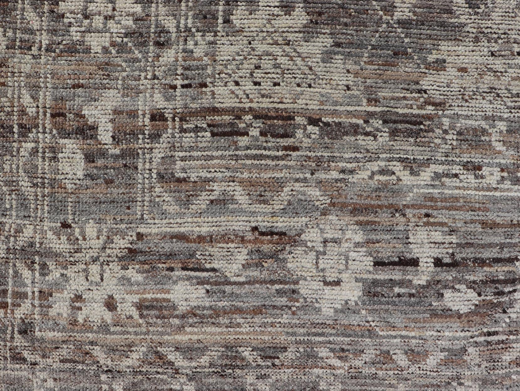 This modern tribal Oushak designed rug has been hand - knotted in wool. The rug features a modern sub - geometric floral design which is enclosed within a complementary, multi - tiered border. The rug is rendered in brown, cream and earthy tones. Measures... - Keivan Woven ArtsAFG - 39912 - 19592Rug