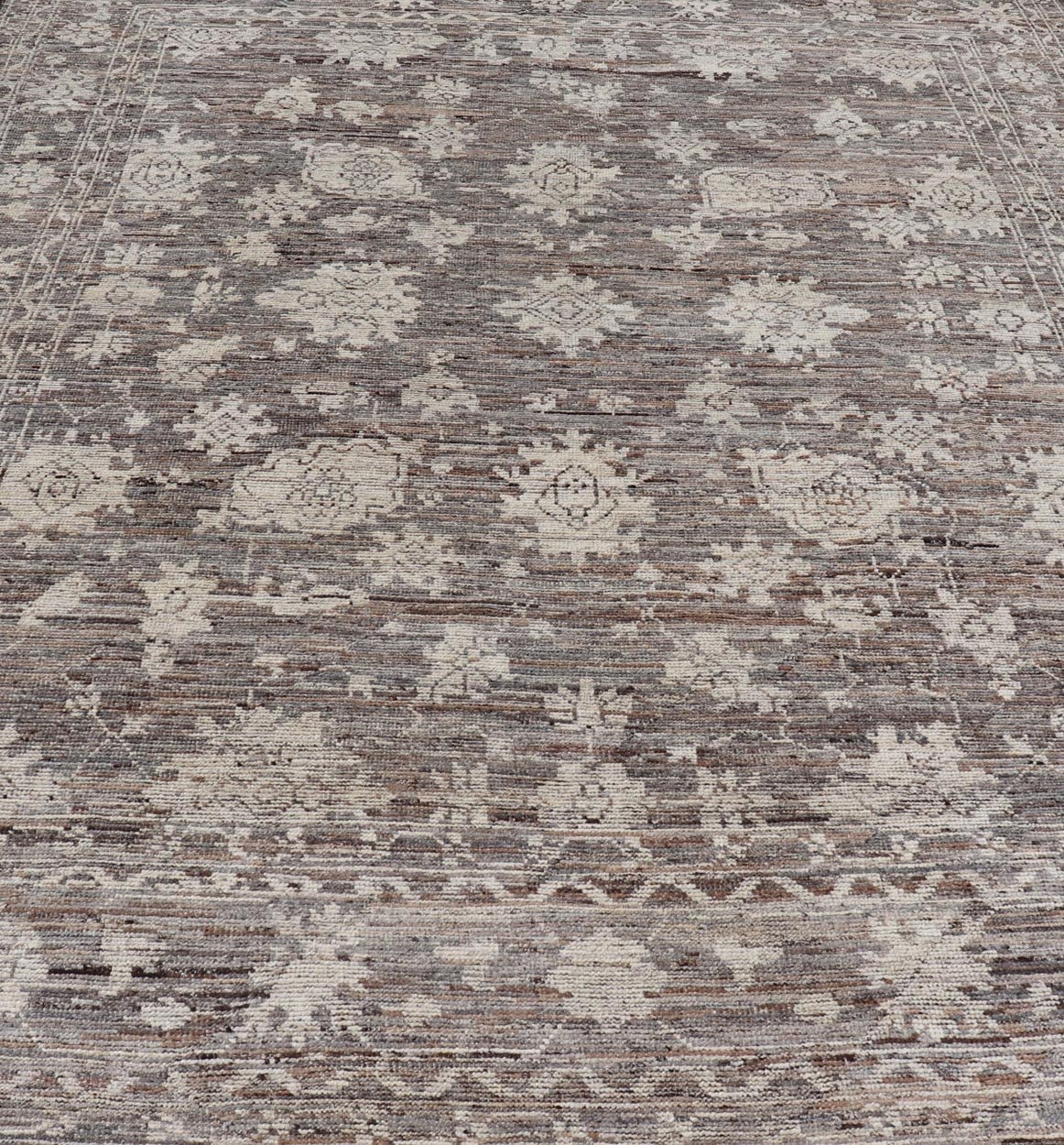 This modern tribal Oushak designed rug has been hand - knotted in wool. The rug features a modern sub - geometric floral design which is enclosed within a complementary, multi - tiered border. The rug is rendered in brown, cream and earthy tones. Measures... - Keivan Woven ArtsAFG - 39912 - 19592Rug