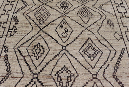 The design of the rug includes a series of interconnected diamond shapes, each containing different motifs such as crosses, zigzags, and other stylized symbols. The central theme is a grid of diamond patterns that vary slightly in size and detail, crea... - Keivan Woven ArtsAFG - 39925 - 19598Rug