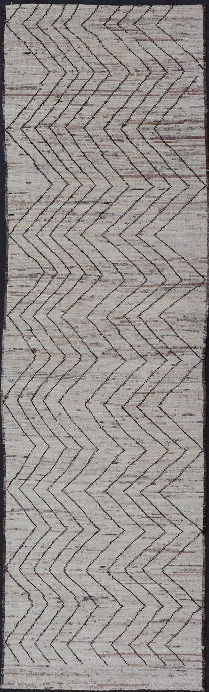 Modern Hand - Knotted Runner in Wool with Sub - Geometric Zig - Zag Design This modern casual runner has been hand - knotted. The rug features a modern sub - geometric zig - zag design, rendered in black and earthy tones, making this rug a superb fit for a... - Keivan Woven ArtsAFG - 39950 - 19238Rug