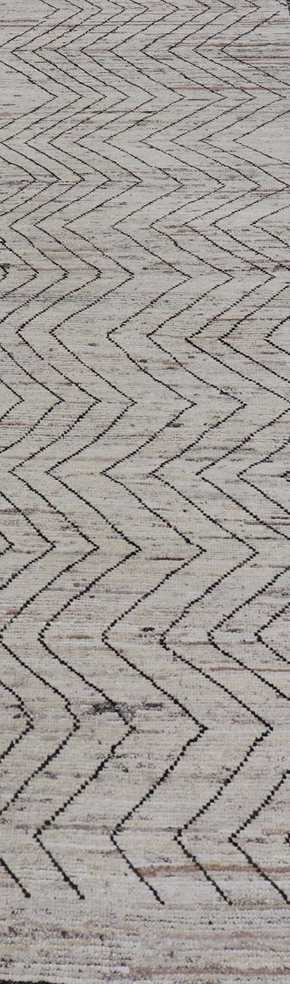 Modern Hand - Knotted Runner in Wool with Sub - Geometric Zig - Zag Design This modern casual runner has been hand - knotted. The rug features a modern sub - geometric zig - zag design, rendered in black and earthy tones, making this rug a superb fit for a... - Keivan Woven ArtsAFG - 39950 - 19238Rug