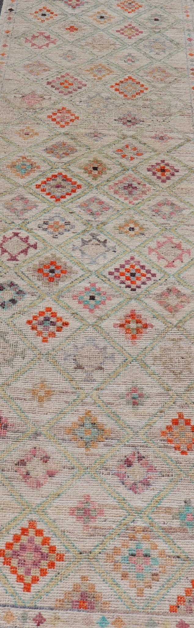 Modern Tulu in Wool with Sub - Geometric Diamond Design in Multicolor This modern casual tribal Tulu runner has been hand - knotted in wool. The rug features a modern sub - geometric diamond design, replete with various motifs in multicolor, making t... - Keivan Woven ArtsAFG - 39977 - 19604Rug