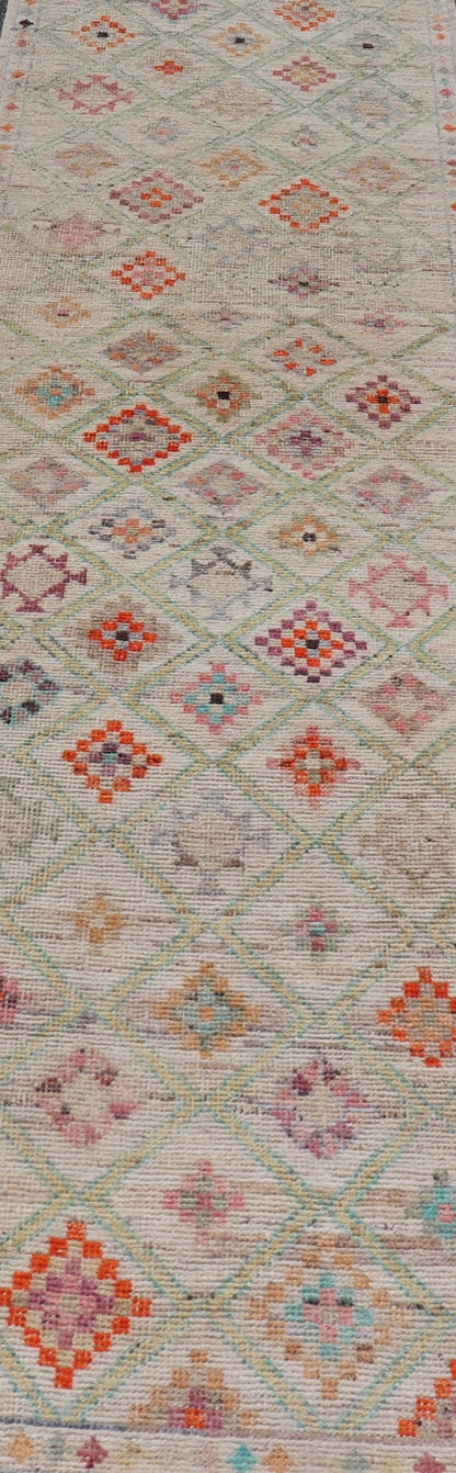 Modern Tulu in Wool with Sub - Geometric Diamond Design in Multicolor This modern casual tribal Tulu runner has been hand - knotted in wool. The rug features a modern sub - geometric diamond design, replete with various motifs in multicolor, making t... - Keivan Woven ArtsAFG - 39977 - 19604Rug