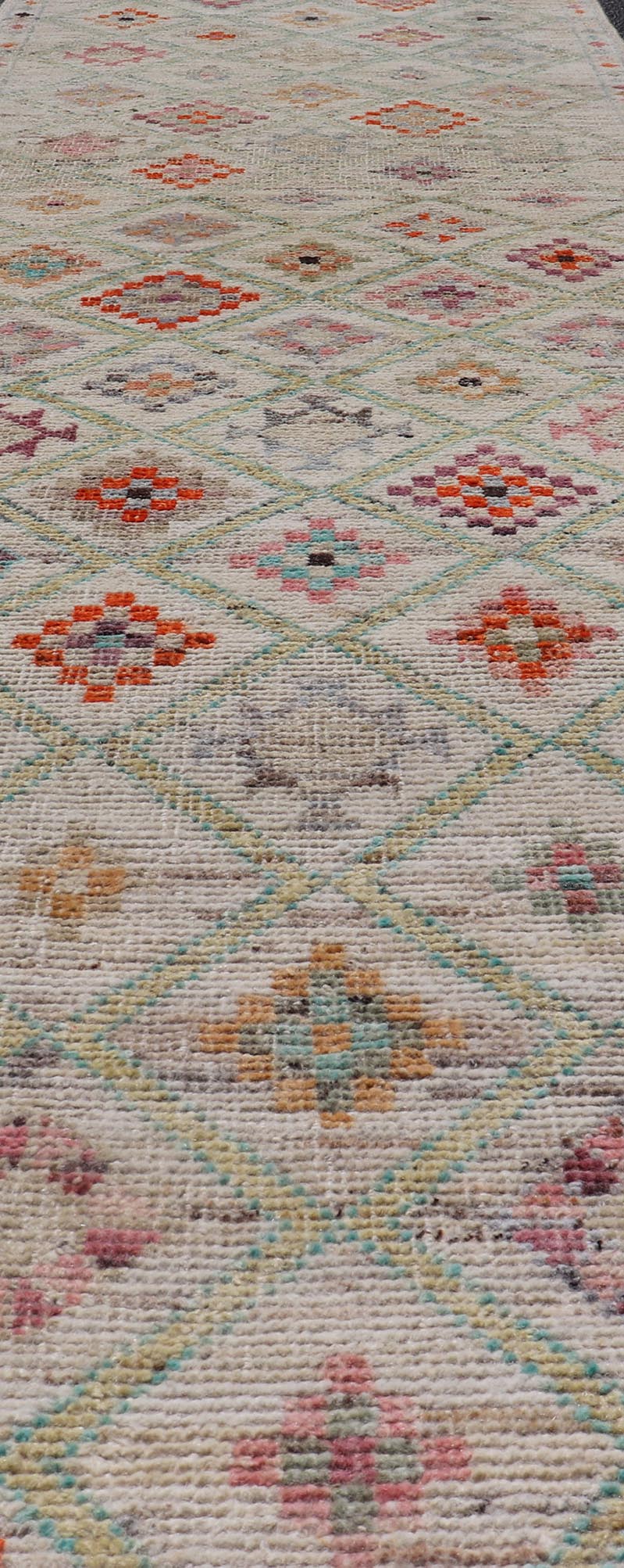 Modern Tulu in Wool with Sub - Geometric Diamond Design in Multicolor This modern casual tribal Tulu runner has been hand - knotted in wool. The rug features a modern sub - geometric diamond design, replete with various motifs in multicolor, making t... - Keivan Woven ArtsAFG - 39977 - 19604Rug