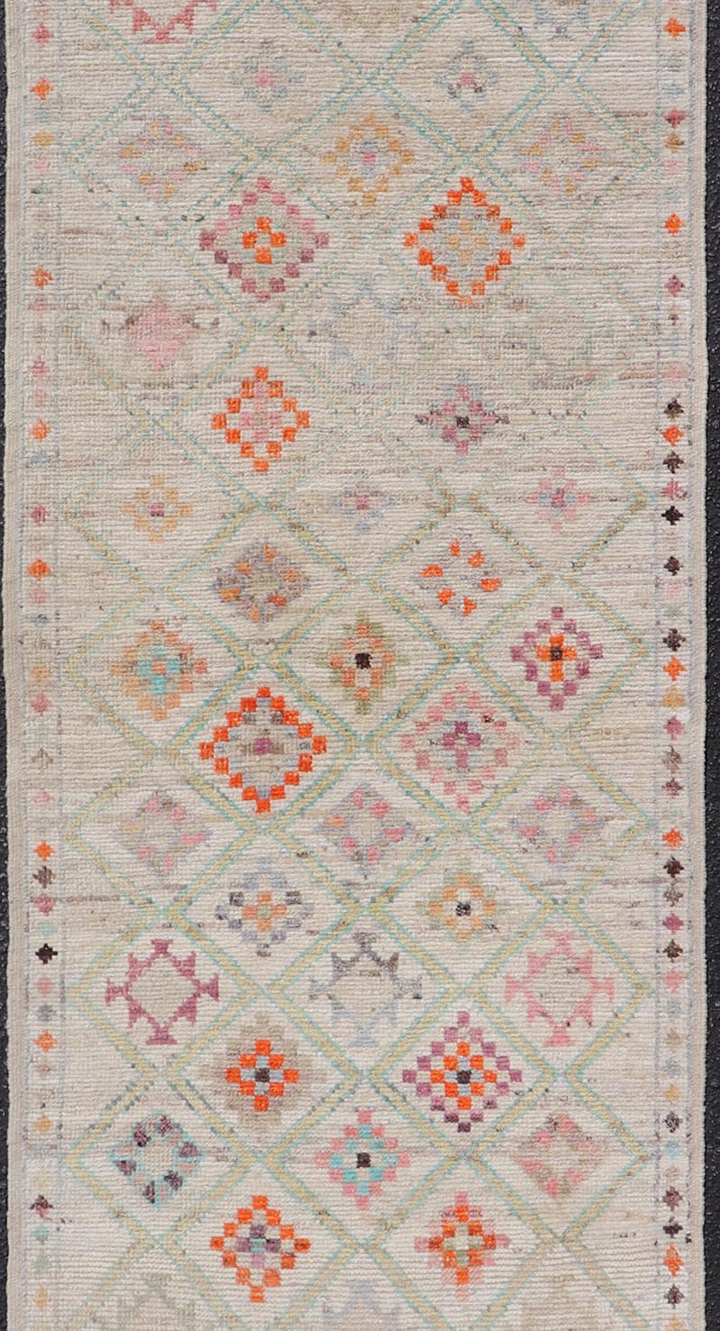 Modern Tulu in Wool with Sub - Geometric Diamond Design in Multicolor This modern casual tribal Tulu runner has been hand - knotted in wool. The rug features a modern sub - geometric diamond design, replete with various motifs in multicolor, making t... - Keivan Woven ArtsAFG - 39977 - 19604Rug