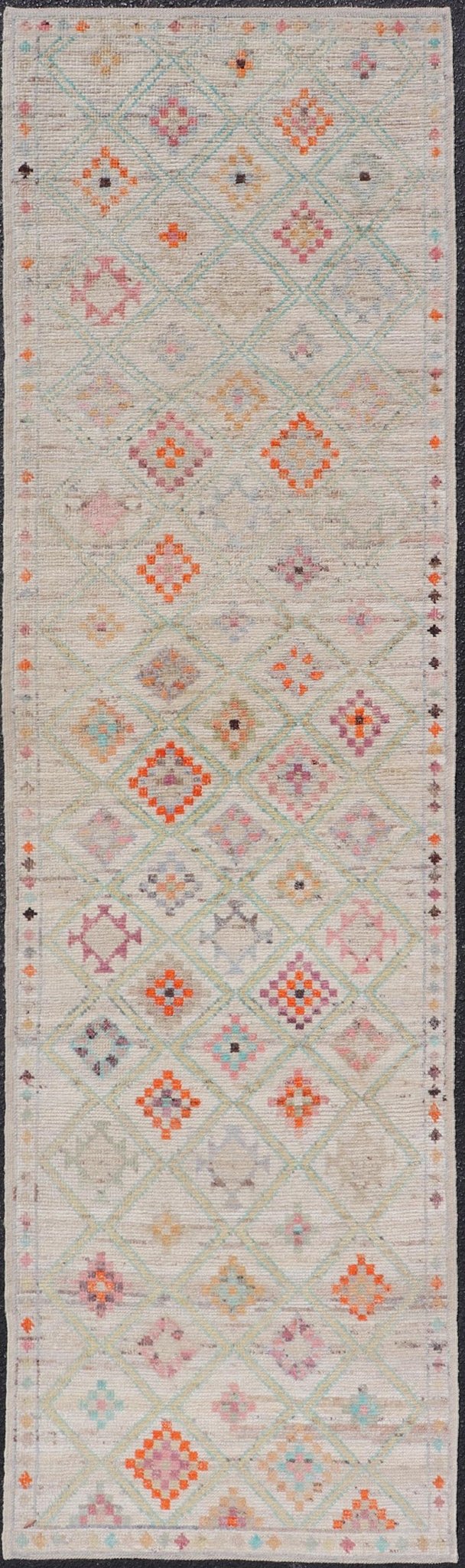 Modern Tulu in Wool with Sub - Geometric Diamond Design in Multicolor This modern casual tribal Tulu runner has been hand - knotted in wool. The rug features a modern sub - geometric diamond design, replete with various motifs in multicolor, making t... - Keivan Woven ArtsAFG - 39977 - 19604Rug