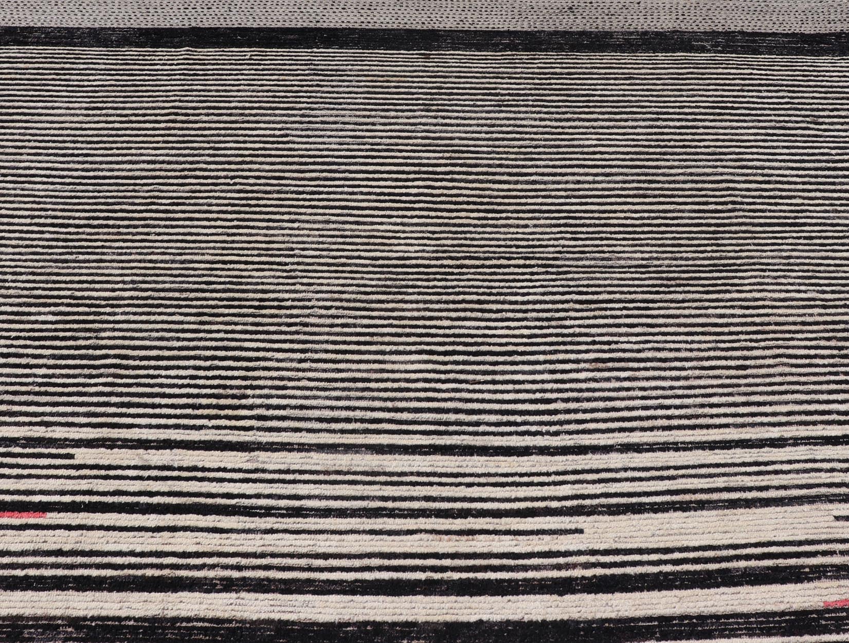 Modern Hand - Knotted Rug in Wool with Abstract Linear Design in Black & Ivory This modern casual tribal rug has been hand - knotted. The rug features a modern sub - geometric abstract linear design, rendered in black and ivory; making this rug a sup... - Keivan Woven ArtsAFG - 40854 - 19436Rug