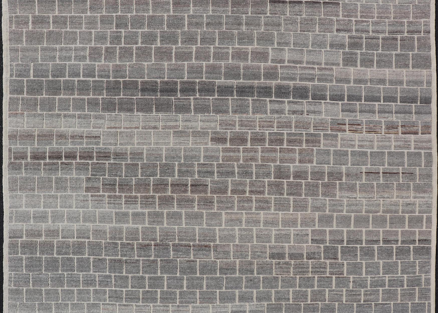 The rug showcases its expansive grid pattern, emphasizing the uniformity and precise alignment of each block. The blocks contrast sharply against the lighter threads, creating a striking visual grid that is both bold and balanced. Perfect for a contemp... - Keivan Woven ArtsAFG - 40986 - 19640Rug