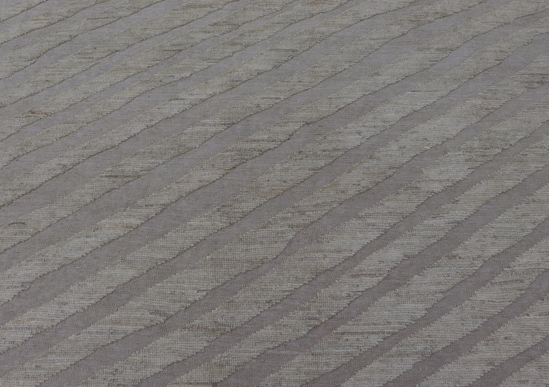 Modern Rug in Wool with Sub - Geometric Slanted Linear Design in Cream and Taupe This modern casual tribal rug has been hand - knotted in wool. The rug features a modern sub - geometric slanted linear design, rendered in creams tones; making this rug ... - Keivan Woven ArtsAFG - 41009 - 19808Rug
