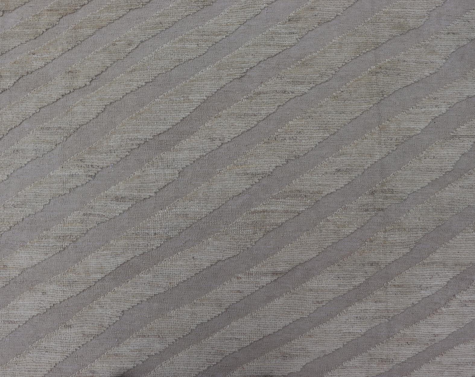 Modern Rug in Wool with Sub - Geometric Slanted Linear Design in Cream and Taupe This modern casual tribal rug has been hand - knotted in wool. The rug features a modern sub - geometric slanted linear design, rendered in creams tones; making this rug ... - Keivan Woven ArtsAFG - 41009 - 19808Rug