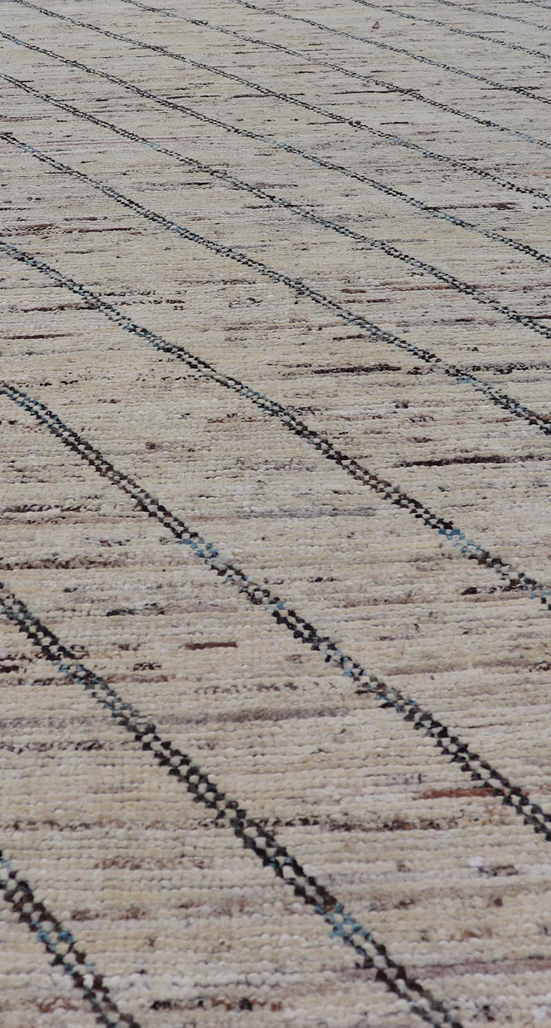 Modern Hand - Knotted Runner in Wool with Slanted Linear Design in Earthy Tones This modern casual tribal rug has been hand - knotted. The rug features a modern linear design, rendered in earthy tones and blues, making this rug a superb fit for a va... - Keivan Woven ArtsAFG - 41031 - 19466Rug