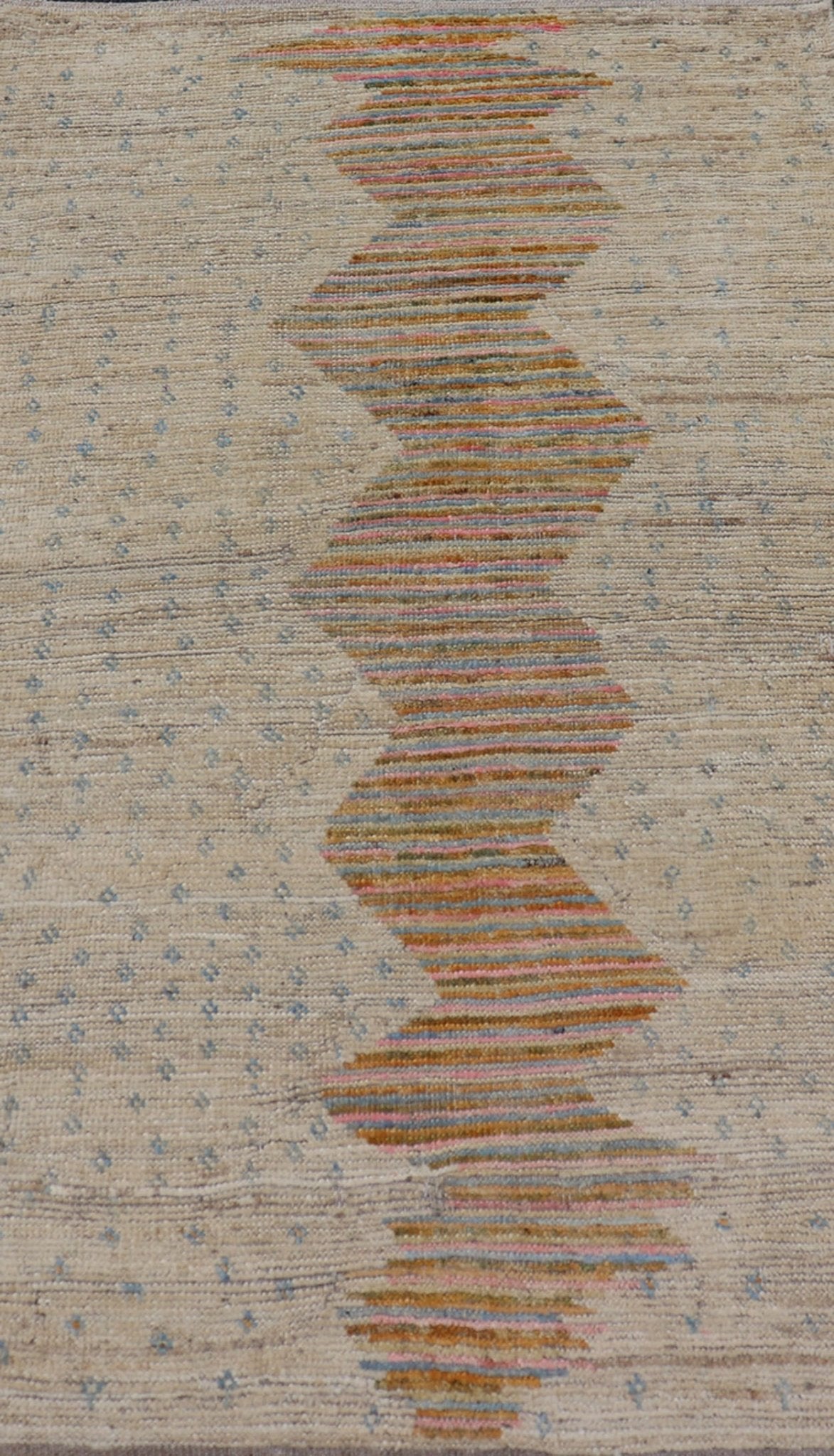 Afghan Modern Casual Hand - Woven in Sand, Mustard, Blue and Pink This contemporary piece displays a sandy background with little blue flecks. The design is a modern zig zag design through the face, opening up to a sandy taupe background and finel... - Keivan Woven ArtsAFG - 43423 - 20259Rug