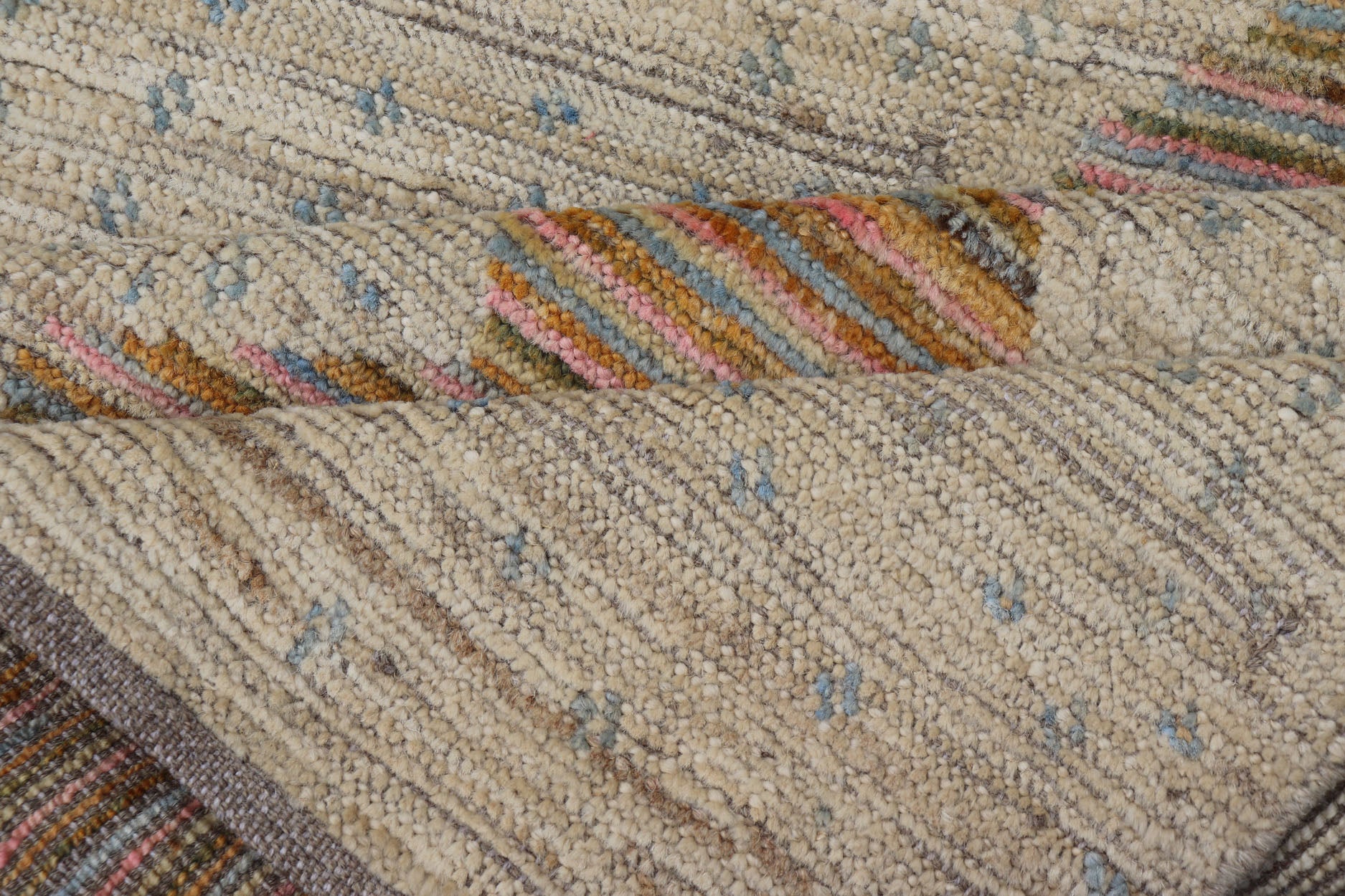 Afghan Modern Casual Hand - Woven in Sand, Mustard, Blue and Pink This contemporary piece displays a sandy background with little blue flecks. The design is a modern zig zag design through the face, opening up to a sandy taupe background and finel... - Keivan Woven ArtsAFG - 43423 - 20259Rug