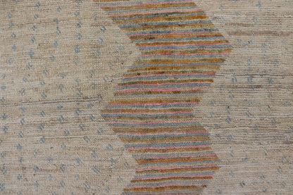 Afghan Modern Casual Hand - Woven in Sand, Mustard, Blue and Pink This contemporary piece displays a sandy background with little blue flecks. The design is a modern zig zag design through the face, opening up to a sandy taupe background and finel... - Keivan Woven ArtsAFG - 43423 - 20259Rug