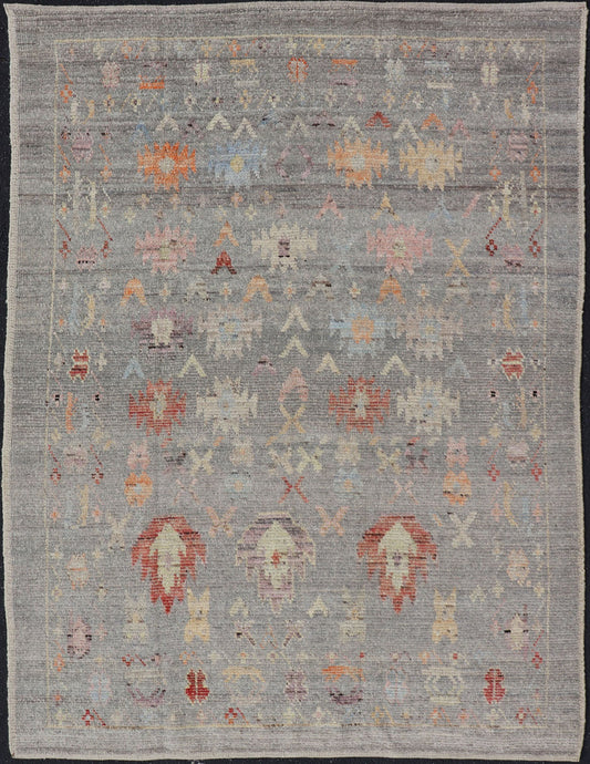 Modern Casual Afghan Hand - Knotted Wool Rug in Taupe Measures: 4'5 x 6'3 This charismatic piece holds much personality in the all - over design of motifs. The tribal - like motifs are rendered in red, beige, pink, blue and small accents of ap... - Keivan Woven ArtsAFG - 43425 - 20253Rug