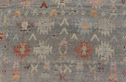 Modern Casual Afghan Hand - Knotted Wool Rug in Taupe Measures: 4'5 x 6'3 This charismatic piece holds much personality in the all - over design of motifs. The tribal - like motifs are rendered in red, beige, pink, blue and small accents of ap... - Keivan Woven ArtsAFG - 43425 - 20253Rug
