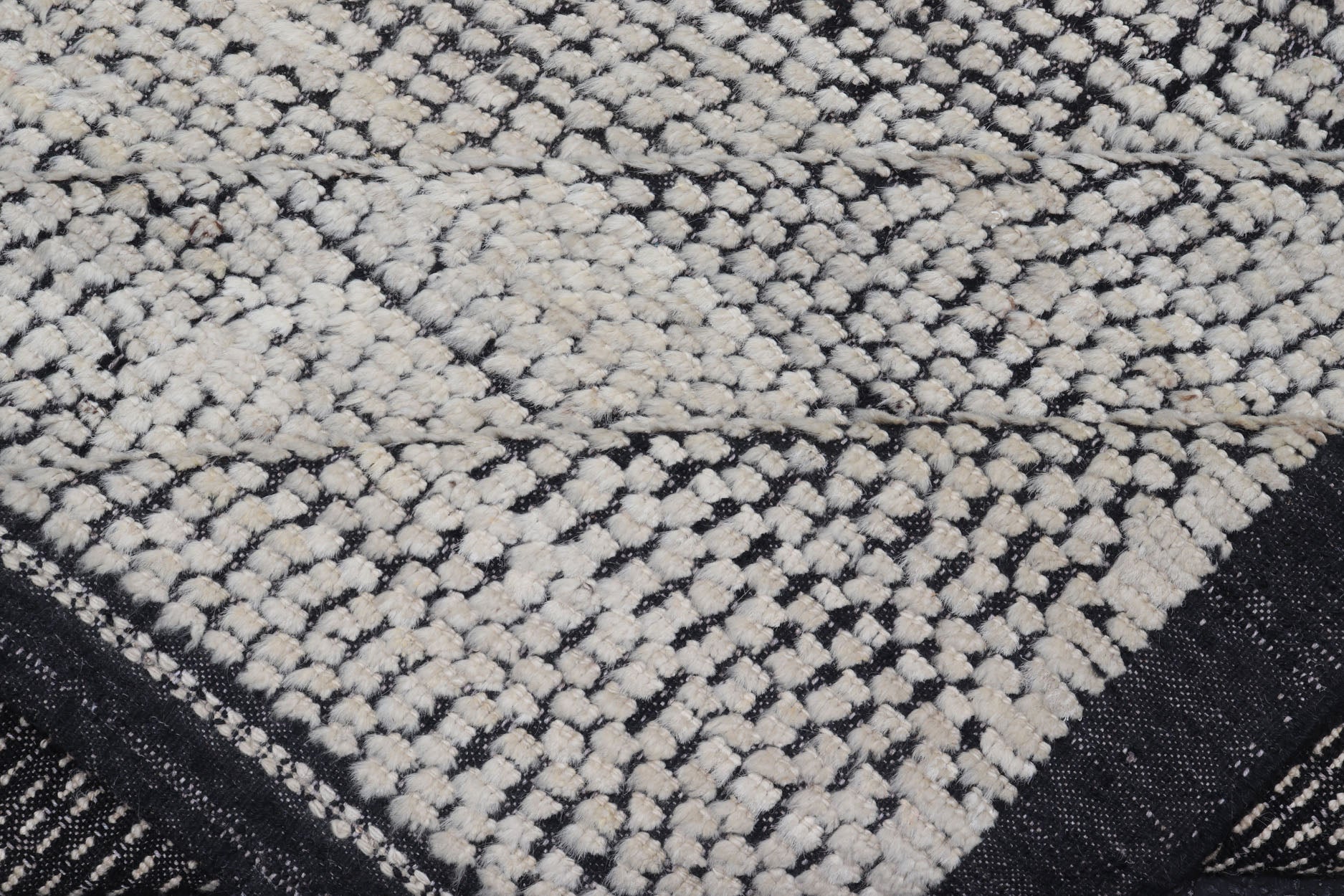 Oversized Afghan Minimalist Modern Casual With Black Background and Ivory Pile This large modern casual rug's field displays a ivory colored pile. Underneath the field shows a black base for a background. These beautiful colors are perfect for ... - Keivan Woven ArtsAFG - 43429 - 20187Rug