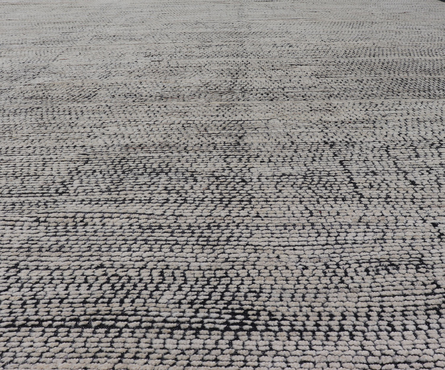 Oversized Afghan Minimalist Modern Casual With Black Background and Ivory Pile This large modern casual rug's field displays a ivory colored pile. Underneath the field shows a black base for a background. These beautiful colors are perfect for ... - Keivan Woven ArtsAFG - 43429 - 20187Rug