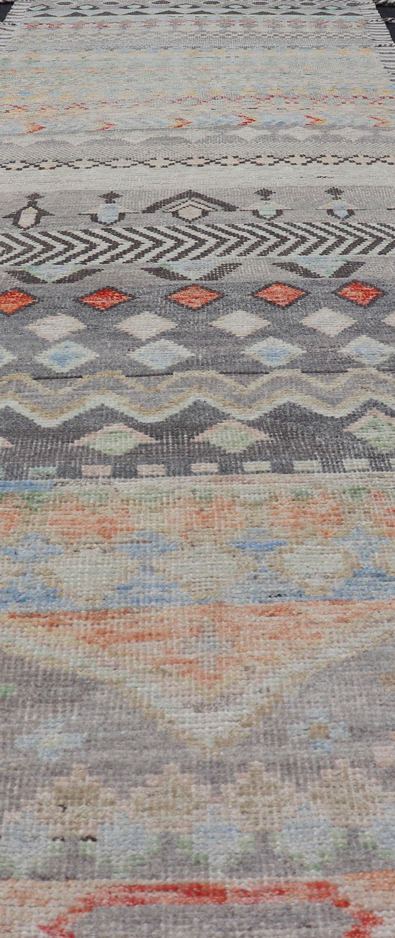 Modern Casual Afghan Gallery Runner in Pastels Hand - woven with wool in Afghanistan, this beautiful gallery piece features a modern yet tribal design in pastels such as coral, blue, jade, emerald, and pink. Bright vibrant red diamonds disturb... - Keivan Woven ArtsAFG - 43430 - 20193Rug