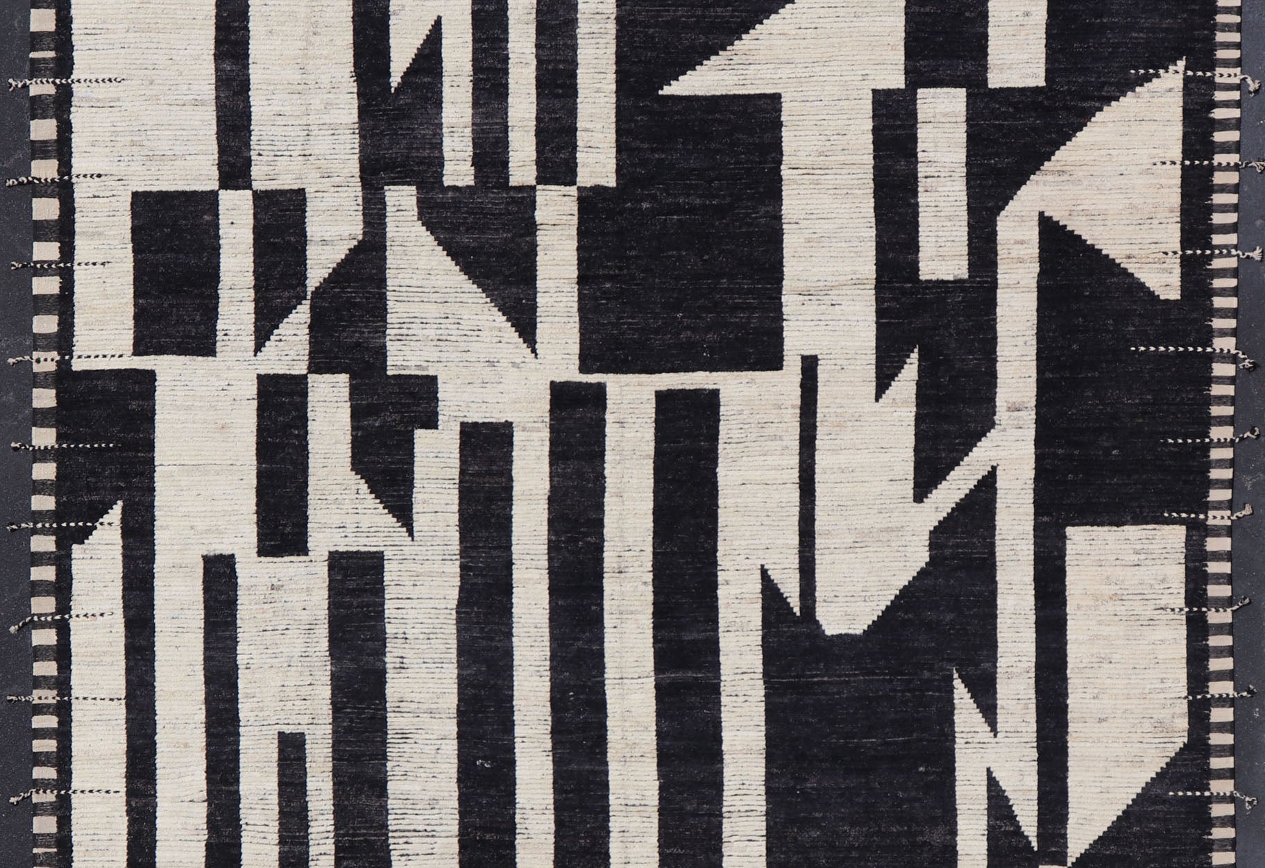 Ebony and Ivory Oversized Abstract Modern Casual This oversized modern casual was hand - knotted in Afghanistan. The field portrays an ivory background disrupted by flashes of ebony abstractions. The small simple border has a crafty ivory embr... - Keivan Woven ArtsAFG - 43436 - 20247Rug