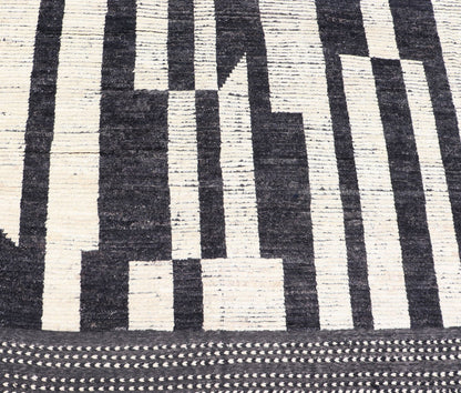Ebony and Ivory Oversized Abstract Modern Casual This oversized modern casual was hand - knotted in Afghanistan. The field portrays an ivory background disrupted by flashes of ebony abstractions. The small simple border has a crafty ivory embr... - Keivan Woven ArtsAFG - 43436 - 20247Rug