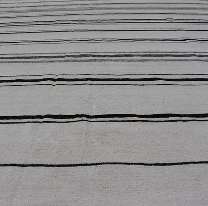 Hand - Woven Cotton Flat Weave Kilim with Geometric Stripe Design This modern Kilim was hand - woven with cotton in Afghanistan. This piece has no border, and a ivory background. The foreground is a minimal asymmetrical horizontal stripe pattern re... - Keivan Woven ArtsAFG - 43445 - 20223Rug