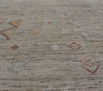 Large Modern Casual Area Rug in Sandy Tones With Pops of Color This elegant modern casual was hand - knotted in Afghanistan. The large open field displays tribal - like motifs atop of warm - yet - subtle sandy hues of beige and light taupe. The des... - Keivan Woven ArtsAFG - 43448 - 20217Rug