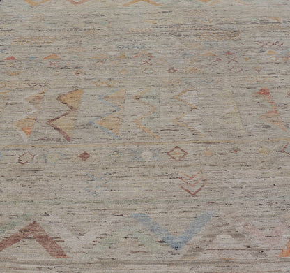 Large Modern Casual Area Rug in Sandy Tones With Pops of Color This elegant modern casual was hand - knotted in Afghanistan. The large open field displays tribal - like motifs atop of warm - yet - subtle sandy hues of beige and light taupe. The des... - Keivan Woven ArtsAFG - 43448 - 20217Rug