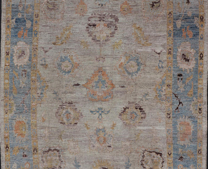Large Floral Designed Modern Oushak on a Cream Field and Light Blue Border. Keivan Woven Arts rug / AFG - 64120 Country of Origin: Afghanistan Type: Oushak Design: Floral, All - Over, Arabesque - Floral 21st century. Measures: 10'5 x 13'10 Modern Ous... - Keivan Woven ArtsAFG - 64120 - 24806Rug