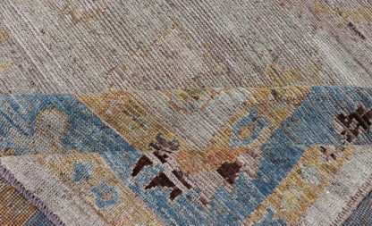Large Floral Designed Modern Oushak on a Cream Field and Light Blue Border. Keivan Woven Arts rug / AFG - 64120 Country of Origin: Afghanistan Type: Oushak Design: Floral, All - Over, Arabesque - Floral 21st century. Measures: 10'5 x 13'10 Modern Ous... - Keivan Woven ArtsAFG - 64120 - 24806Rug