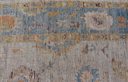 Large Floral Designed Modern Oushak on a Cream Field and Light Blue Border. Keivan Woven Arts rug / AFG - 64120 Country of Origin: Afghanistan Type: Oushak Design: Floral, All - Over, Arabesque - Floral 21st century. Measures: 10'5 x 13'10 Modern Ous... - Keivan Woven ArtsAFG - 64120 - 24806Rug