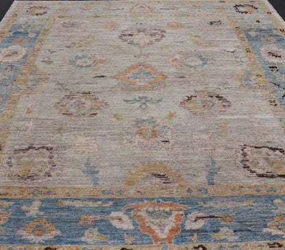 Large Floral Designed Modern Oushak on a Cream Field and Light Blue Border. Keivan Woven Arts rug / AFG - 64120 Country of Origin: Afghanistan Type: Oushak Design: Floral, All - Over, Arabesque - Floral 21st century. Measures: 10'5 x 13'10 Modern Ous... - Keivan Woven ArtsAFG - 64120 - 24806Rug